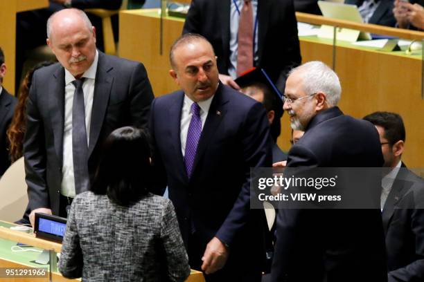 Minister for Foreign Affairs of Turkey Mevlut Cavusoglu talks with Iranian Foreign Affairs Minister Mohammad Javad Zarif during the High-level...