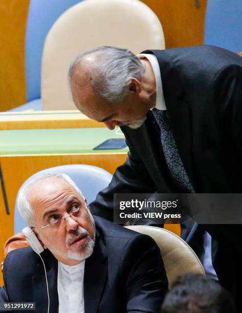 Iranian Foreign Affairs Minister Mohammad Javad Zarif speaks with Bashar Jaafari, permanent Representative of the Syrian Arab Republic to the United...