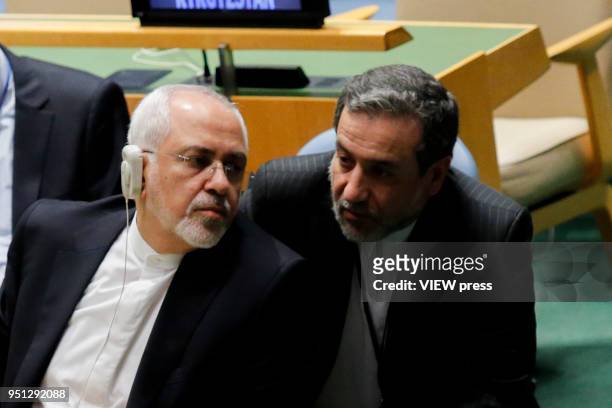 Iranian Foreign Affairs Minister Mohammad Javad Zarif talks with one of his delegation members as he attends the High-level Meeting on Peacebuilding...