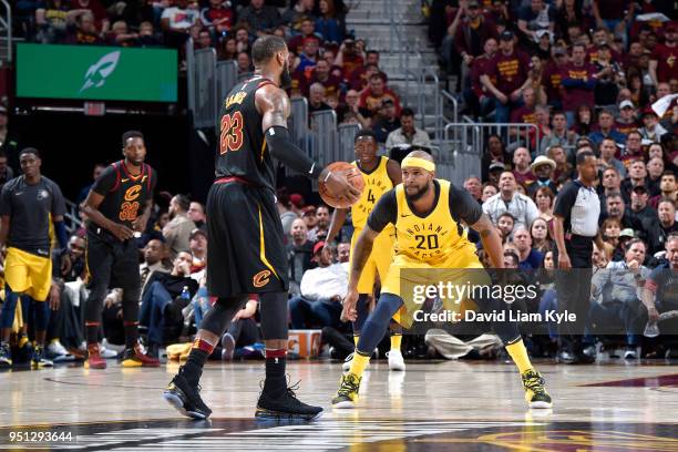 LeBron James of the Cleveland Cavaliers handles the ball against Trevor Booker of the Indiana Pacers in Game Five of Round One of the 2018 NBA...