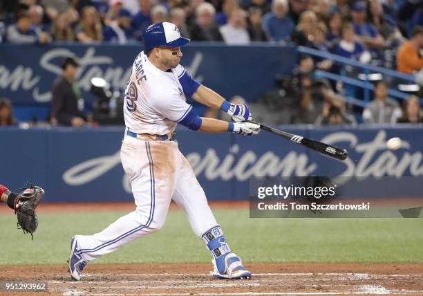Steve Pearce of the Toronto Blue Jays hits an RBI single in the fifth inning during MLB game action against the Boston Red Sox at Rogers Centre on...