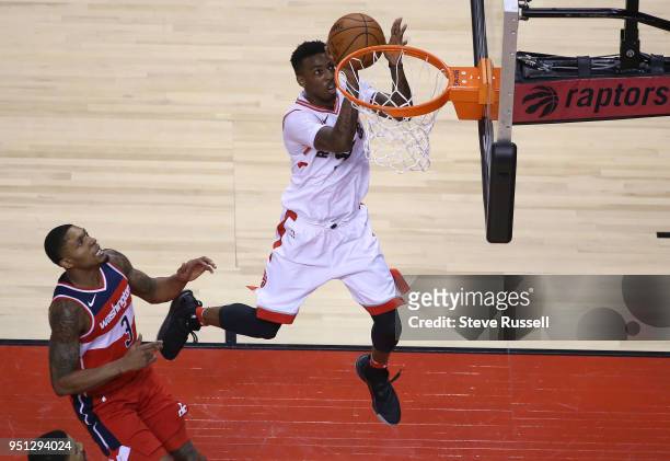 Washington Wizards guard Bradley Beal watches as Toronto Raptors guard Delon Wright lays up a shot as the Toronto Raptors play game five of their...