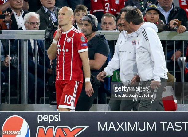 Injured, Arjen Robben of Bayern Munich has to leave the pitch and be replaced during the UEFA Champions League Semi Final first leg match between...