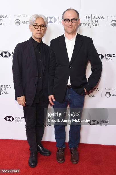 Ryuichi Sakamoto and Stephen Nomura Schible attend the screening of "Ryuichi Sakamoto: Coda" during the 2018 Tribeca Film Festival at Cinepolis...