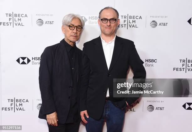 Ryuichi Sakamoto and Stephen Nomura Schible attend the screening of "Ryuichi Sakamoto: Coda" during the 2018 Tribeca Film Festival at Cinepolis...