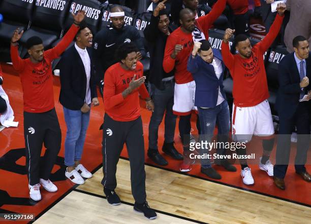 The Toronto bench celebrates as the Toronto Raptors win game five of their first round of the NBA playoffs against the Washington Wizards 108-98 at...
