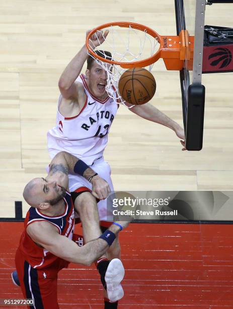 Toronto Raptors center Jakob Poeltl dunks on Washington Wizards center Marcin Gortat as the Toronto Raptors win game five of their first round of the...