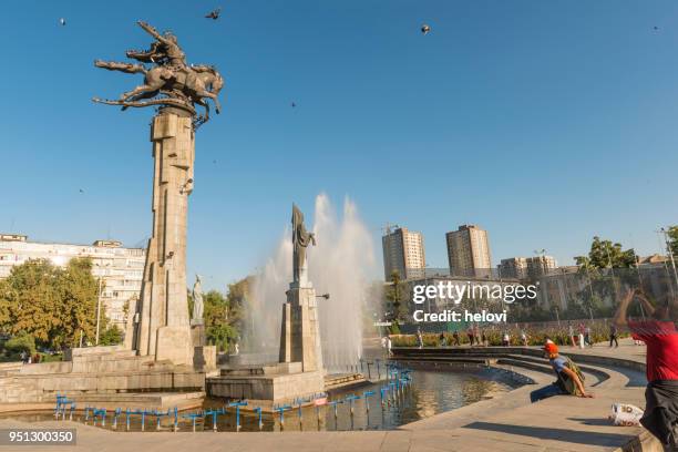 manas statue in fountain with urban background - kyrgyzstan city stock pictures, royalty-free photos & images