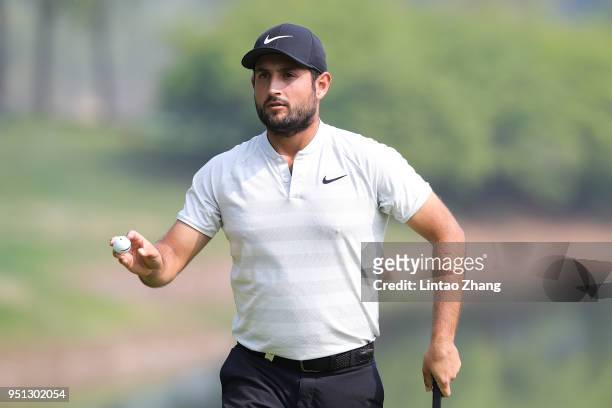 Alexander Levy of France waves his ball to the fans during the first round of the 2018 Volvo China Open at Topwin Golf and Country Club on April 26,...