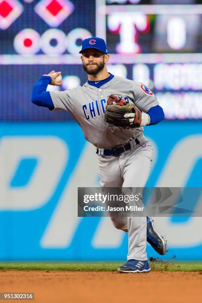 Third baseman Tommy La Stella of the Chicago Cubs throws out Yan Gomes of the Cleveland Indians at first during the seventh inning at Progressive...