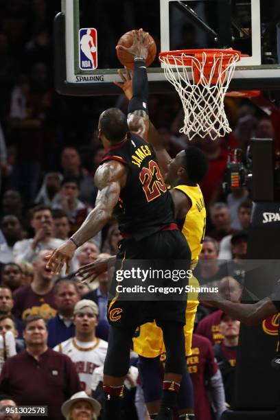LeBron James of the Cleveland Cavaliers blocks the shot of Victor Oladipo of the Indiana Pacers late Game Five of the Eastern Conference...
