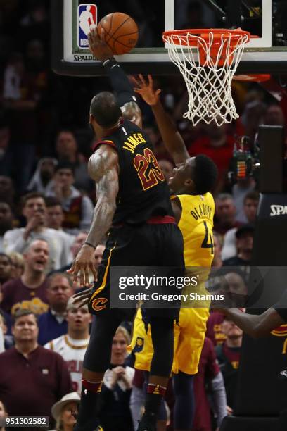 LeBron James of the Cleveland Cavaliers blocks the shot of Victor Oladipo of the Indiana Pacers late Game Five of the Eastern Conference...