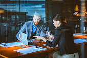 Man and Woman Having a Discussion During Lunch Time in a High-End Restaurant