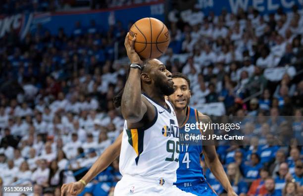 Jae Crowder of the Utah Jazz drives around Josh Huestis of the Oklahoma City Thunder for a two pint shot during the first half of game 5 of the...
