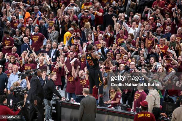 LeBron James of the Cleveland Cavaliers addresses the crowd after hitting the game winning shot in Game Five of Round One of the 2018 NBA Playoffs on...