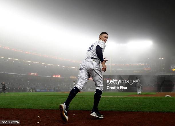 Aaron Judge of the New York Yankees takes the field to start the ninth inning against the Minnesota Twins at Yankee Stadium on April 25, 2018 in the...