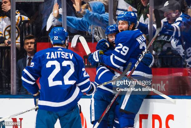 William Nylander of the Toronto Maple Leafs celebrates his goal with teammates Nikita Zaitsev and Nazem Kadri against the Boston Bruins in Game Six...