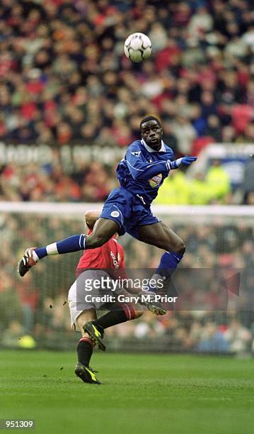 Ade Akinbiyi of Leicester City wins the header during the FA Carling Premiership match against Manchester United played at Old Trafford, in...