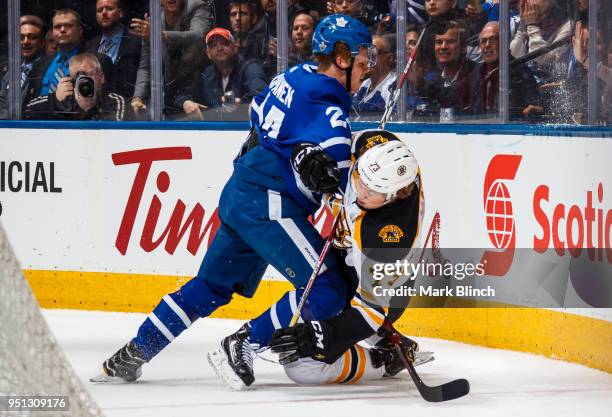 Kasperi Kapanen of the Toronto Maple Leafs checks Charlie McAvoy of the Boston Bruins in Game Six of the Eastern Conference First Round during the...