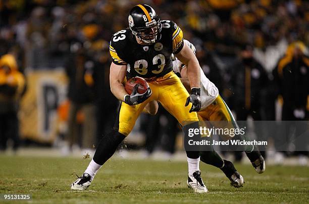 Heath Miller of the Pittsburgh Steelers attempts to break through a tackle by AJ Hawk of the Green Bay Packers during the game on December 20, 2009...