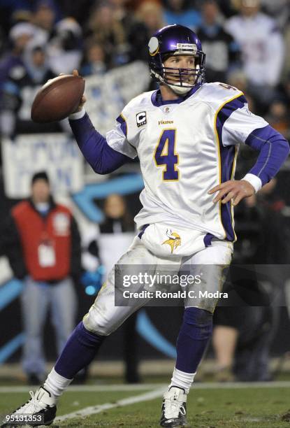 Quarterback Brett Favre of the Minnesota Vikings looks for a receiver during a NFL game against the Carolina Panthers at Bank of America Stadium on...