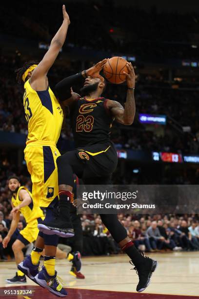 LeBron James of the Cleveland Cavaliers drives to the basket against Myles Turner of the Indiana Pacers during the second half of Game Five of the...