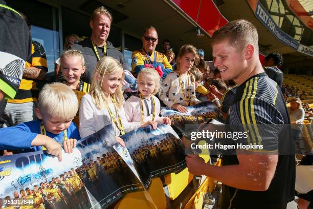 James O'Reilly interacts with fans during a Hurricanes Super Rugby Captain's Run at Westpac Stadium on April 26, 2018 in Wellington, New Zealand.