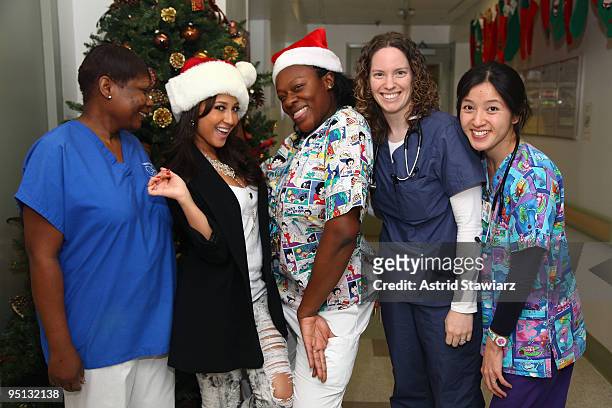 Nurse Renee Lapin, actress/ singer Adrienne Bailon, nurse Kena Johnson Dr. Meaghan Mungekar and nurse Jessica Chen pose for photos at the Beth Israel...