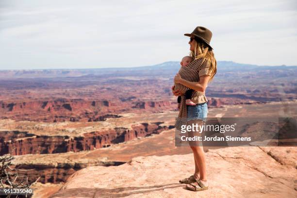 a young mom and her baby - canyonlands national park stock pictures, royalty-free photos & images