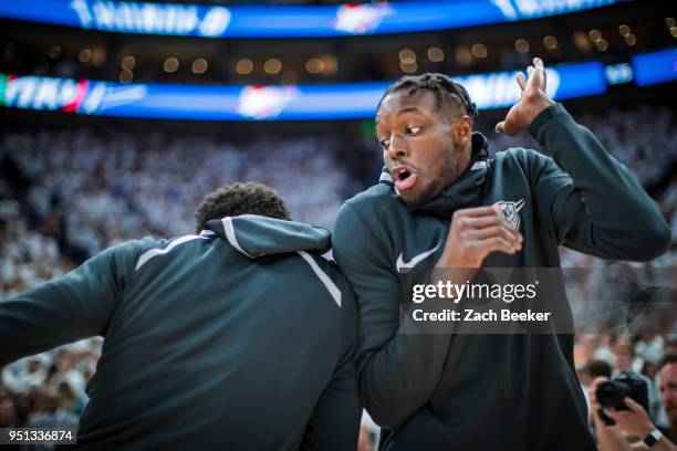 Jerami Grant of the Oklahoma City Thunder hip-bumps teammate before the game against the Utah Jazz in Game Four of Round One of the 2018 NBA Playoffs...