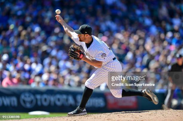 Colorado Rockies relief pitcher Bryan Shaw pitches during a regular season Major League Baseball game between the Chicago Cubs and the Colorado...
