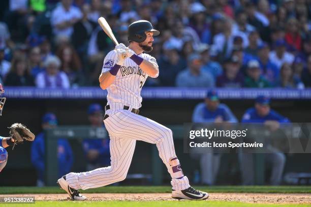 Colorado Rockies outfielder David Dahl singles during a regular season Major League Baseball game between the Chicago Cubs and the Colorado Rockies...