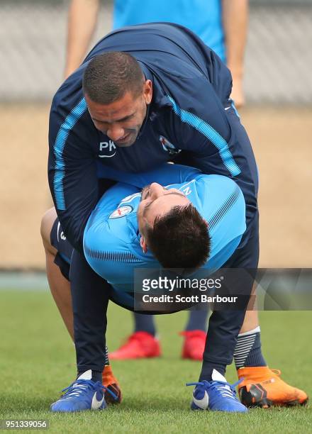 Patrick Kisnorbo, assistand coach of City FC holds Bruno Fornaroli of City FC during a Melbourne City FC A-League training session at City Football...