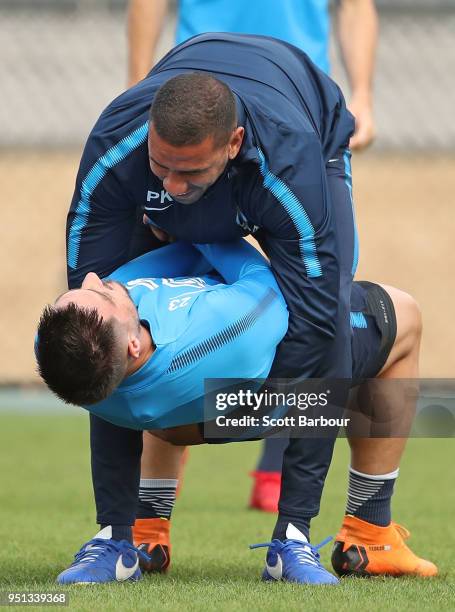 Patrick Kisnorbo, assistand coach of City FC holds Bruno Fornaroli of City FC during a Melbourne City FC A-League training session at City Football...