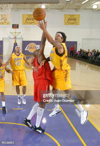 Keith Clark of the Los Angeles D-Fenders shoots a layup against Anthony Tolliver of the Idaho Stampede during the game at the Toyota Sports Center on...