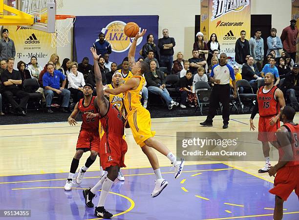 Diamon Simpson of the Los Angeles D-Fenders shoots a layup against Anthony Tolliver of the Idaho Stampede during the game at the Toyota Sports Center...