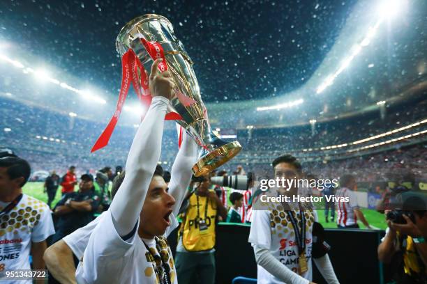 Isaac Brizuela of Chivas celebrates with the champions trophy during the second leg match of the final between Chivas and Toronto FC as part of...