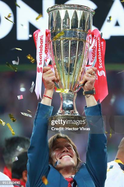 Matias Almeyda, Head Coach of Chivas celebrates with the champions trophy after the second leg match of the final between Chivas and Toronto FC as...