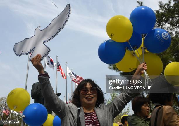 Members of the South Korean women's peace group participate in a rally to support the upcoming inter-Korea summit, at Imjingak peace park in Paju...