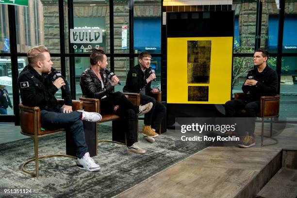 Zach Myers, Eric Bass and Brent Smith of Shinedown discusses "Attention Attention" with the Build Series at Build Studio on April 25, 2018 in New...