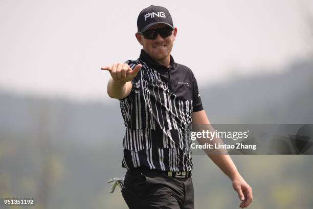 Matt Wallace of England waves his ball to the fans during the first round of the 2018 Volvo China Open at Topwin Golf and Country Club on April 26,...