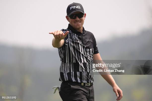 Matt Wallace of England waves his ball to the fans during the first round of the 2018 Volvo China Open at Topwin Golf and Country Club on April 26,...