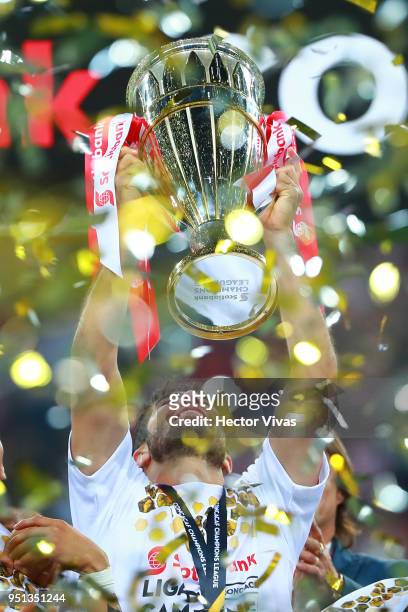 Jair Pereira of Chivas celebrates with the champion trophy during the second leg match of the final between Chivas and Toronto FC as part of CONCACAF...