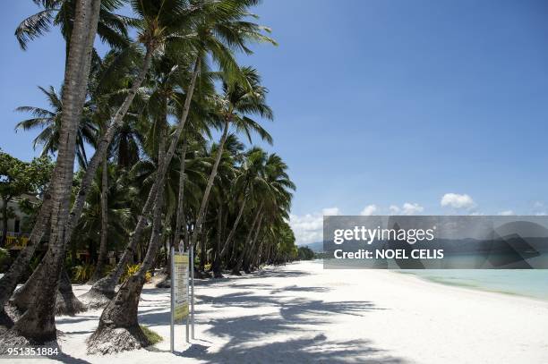 General view shows an empty beach on the Philippine island of Boracay on April 26, 2018. - The Philippines shuttered its most famous holiday island...