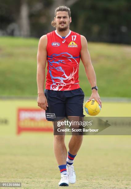 Tom Boyd of the Bulldogs holds the ball during a Western Bulldogs AFL training session at Whitten Oval on April 26, 2018 in Melbourne, Australia.