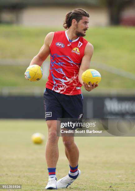 Tom Boyd of the Bulldogs holds the ball during a Western Bulldogs AFL training session at Whitten Oval on April 26, 2018 in Melbourne, Australia.