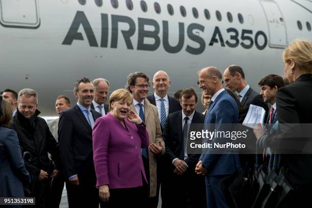 German Chancellor Angela Merkel and Airbus CEO Thomas Enders chat in front of an Airbus A350 during the Innovation and Leadership in Aerospace...
