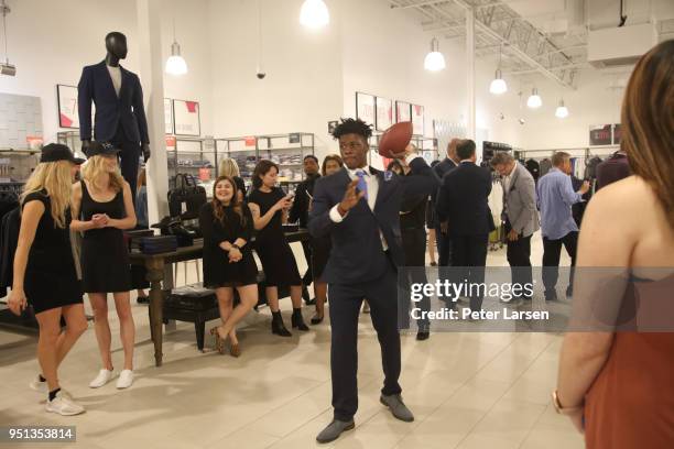 Richie James throws footballs for charity at the Fashion & Football Event at Saks Off 5TH> on April 25, 2018 in Grand Prairie, Texas.