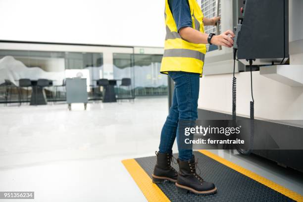 woman working in machining shop - smart shoes stock pictures, royalty-free photos & images
