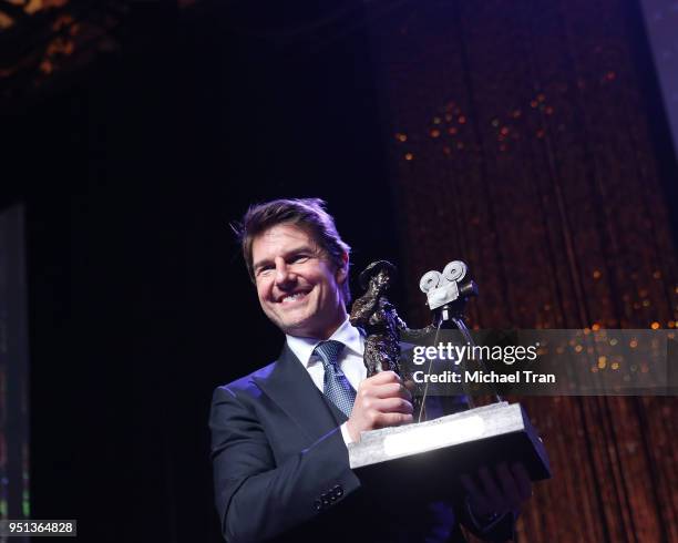 Tom Cruise accepts his award onstage during the 2018 CinemaCon - The Will Rogers Motion Picture Pioneer's Foundation Dinner held at The Colosseum at...